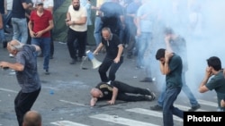 Armenia - A protester is injured by a stun grenade thrown by police, June 12, 2024.