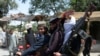 Taliban militants ride a motorbike as they took to the street to celebrate ceasefire in Jalalabad on June 16.