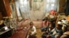 Back to normal in Andijon? A file photo shows a family watching television in the eastern Uzbek city.
