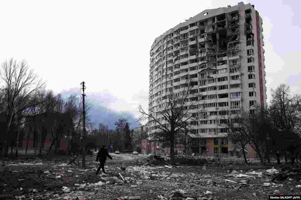 UKRAINE - A man walks in front of a residential building damaged in yesterday's shelling in the city of Chernihiv on March 4, 2022