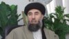 In this file photo taken, 17 October 2001, Gulbuddin Hekmatyar, a former Afghan warlord in exile in Iran, gives an interview to AFP in Tehran. As stated in a report released, 21 November 2004, Warlord Gulbuddin Hekmatyar, who is wanted by Washin