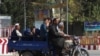 Residents of Kunduz leave the city amid ongoing fighting between Taliban militants and Afghan security forces in Kunduz on October 5.