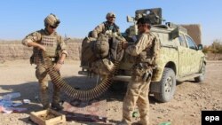Afghan soldiers shown sorting ammunition during an operation against Taliban militants in Soor Guder district of Helmand in November 2016.