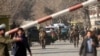 Afghan security forces inspect at the site of a deadly suicide attack in the center of Kabul on January 27.