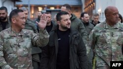 Ukrainian President Volodymyr Zelenskiy (center) arrives at a U.S. Army base in Wiesbaden, Germany, on December 14. 