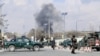 Security forces guard the area as smoke billows from the Sardar Daud Khan's Hospital, also known as Kabul Military Hospital, during an attack by suspected militants in Kabul on March 8.