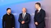 Президент України Володимир Зеленський, тогочасний канцлер Німеччини Олаф Шольц та прем'єр-міністр Чорногорії Мілойко Спаїч (крайній справа). Берлін, Німеччина, червень 2024 року