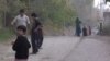 Children play along a roadside in Isfara district. There is little else to do in the town, which has no movie theater or mall.