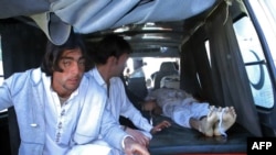 Pakistani relatives transport the body of a blast victim at a hospital after a bomb explosion at a market in Parachinar, the capital of Kurram tribal district, on December 13. 