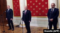 RUSSIA -- Russian President Vladimir Putin (C), Armenian Prime Minister Nikol Pashinian (R) and Azerbaijani President Ilham Aliyev deliver a joint statement following their talks in Moscow, January 11, 2021.