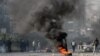 Supporters of opposition party, Tehrik-e Insaf burned tyres during a protest in Karachi on December 12.